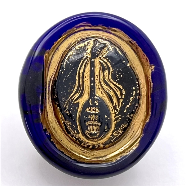 Bimini cobalt blue glass button of a mandolin.