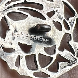 Silver button of a flower.