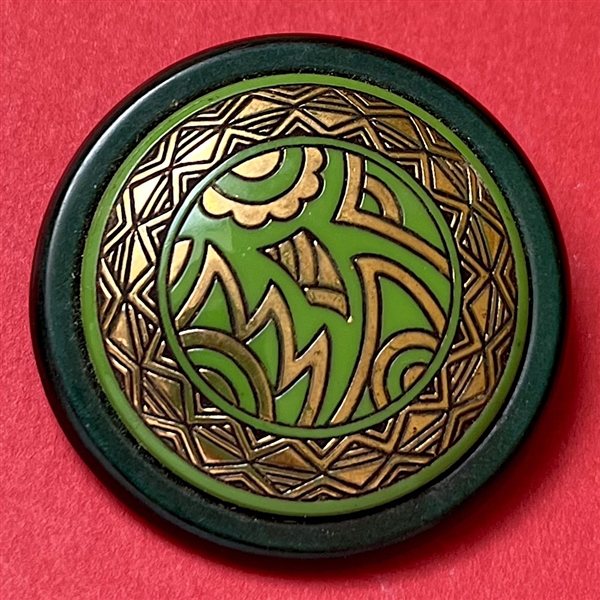 Art Deco Green glass button design set in celluloid.
