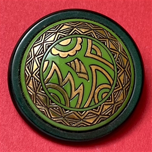 Art Deco Green glass button design set in celluloid.