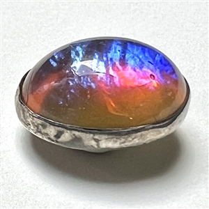 Dragon’s Breath glass set in silver button.