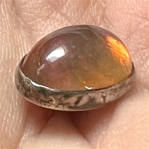 Dragon’s Breath glass set in silver button.