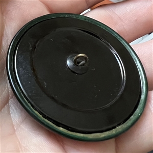 Art Deco Green glass button design set in celluloid.