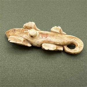 Huge realistic lizard button.