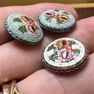 Three Italian mosaic buttons of flowers.