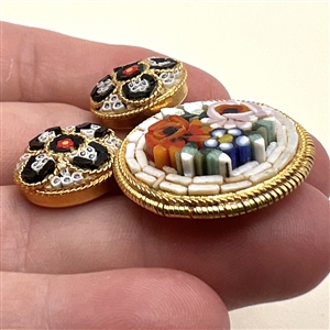 Three Italian mosaic buttons of flowers and patterns.