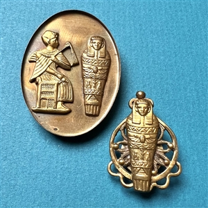 Two Egyptian theme studio buttons by Kevin Kinne.