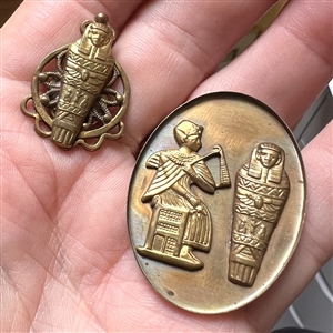 Two Egyptian theme studio buttons by Kevin Kinne.
