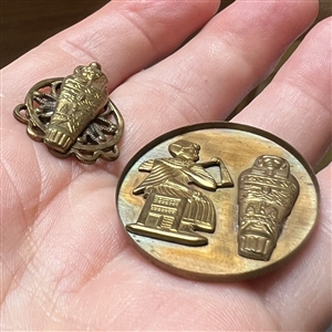 Two Egyptian theme studio buttons by Kevin Kinne.