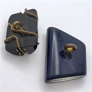 Two Italian casein realistic buttons.