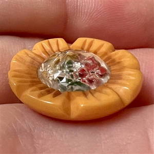 Design under glass Bakelite button.