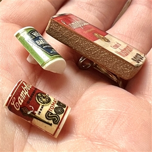 Three buttons of assorted food cans.