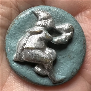 Acrylic shot (?) button of a piper.