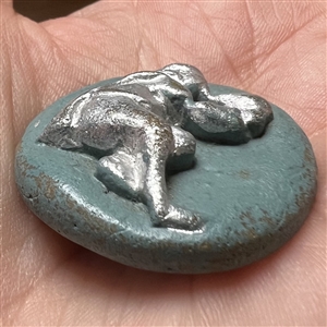 Acrylic shot (?) button of a piper.