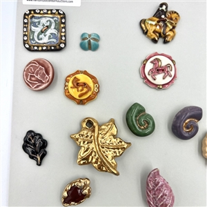 Card of thirty five ceramic buttons.
