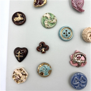 Card of thirty five ceramic buttons.