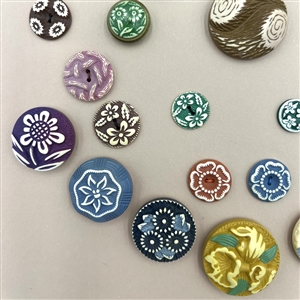 Card of thirty nine buffed celluloid buttons.