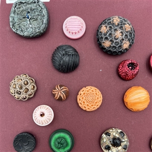 Card of thirty four French textured plastic buttons.