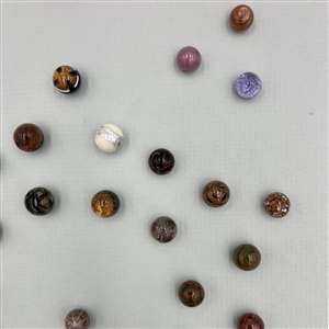 Card of forty three glass ball buttons.