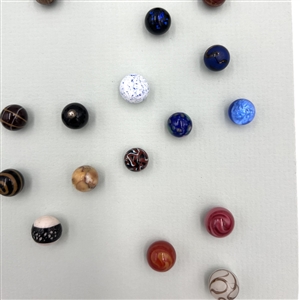 Card of forty three glass ball buttons.