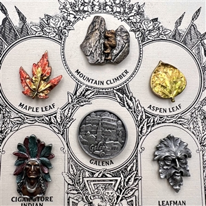 Set of nine Battersea pewter buttons on original sample card.