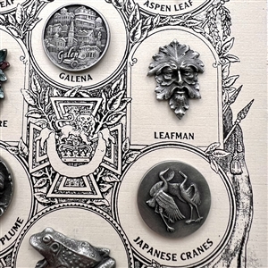 Set of nine Battersea pewter buttons on original sample card.
