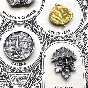 Set of nine Battersea pewter buttons on original sample card.