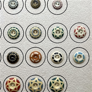 Card of 42 aluminum stencil buttons.