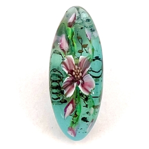 Mary Gaumond’s paper weight button of iris studio button.