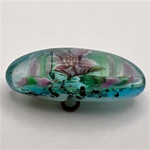 Mary Gaumond’s paper weight button of iris studio button.