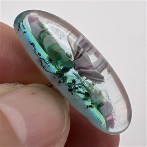 Mary Gaumond’s paper weight button of iris studio button.