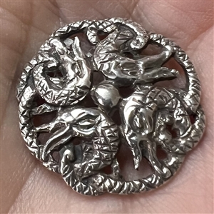 Hallmarked silver button with four snakes.