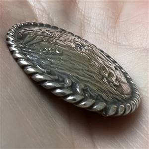 Dutch silver button of man and woman musicians.
