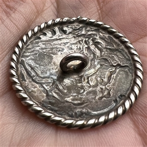 Dutch silver button of man and woman musicians.