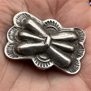 Pewter button with Native American butterfly design.