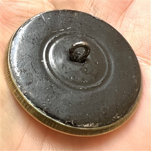 Champlevé enamel button of woman in 18th c. apparel.