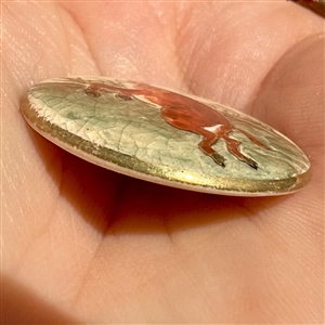Satsuma button of a rushing, wild boar.