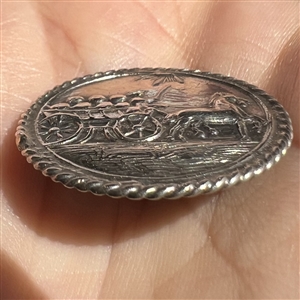 Hallmarked silver button of a horse drawn cart.