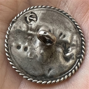 Hallmarked silver button of a horse drawn cart.