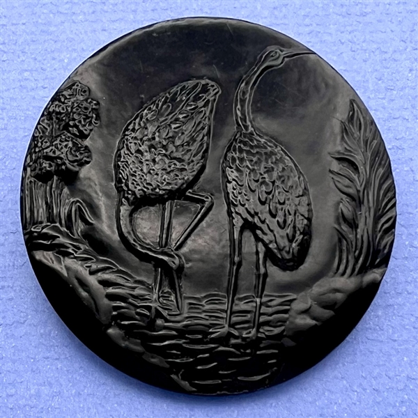 Huge Vintage celluloid button of two cranes.