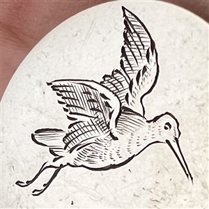 Hallmarked silver sporting button of a bird.