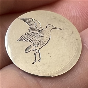 Hallmarked silver sporting button of a bird.