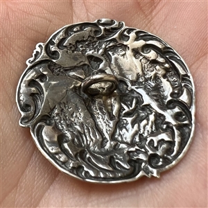 Hallmarked silver button of a courting couple.