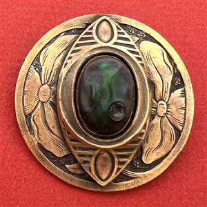 Gay 90’s type button with unique oval iridescent-green glass center.