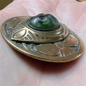 Gay 90’s type button with unique oval iridescent-green glass center.