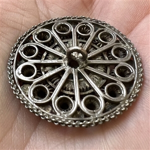 Peasant silver filigree dress button.