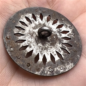 An 18th c. Pierced steel button.
