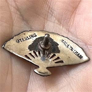 Niello silver button of a realistic fan.