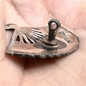 Niello silver button of a realistic fan.
