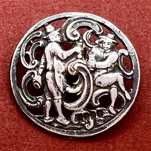 Hallmarked silver button of two men drinking.